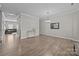 Open-concept living room with decorative wall trim and neutral color palette, creating a bright and airy space at 13315 Hunting Birds Ln, Charlotte, NC 28278