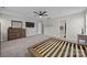 Bright main bedroom with neutral carpeting, and ample space for a king-sized bed and other bedroom furniture at 13315 Hunting Birds Ln, Charlotte, NC 28278