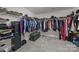 Spacious walk-in closet with ample shelving and hanging space for organized storage at 13315 Hunting Birds Ln, Charlotte, NC 28278
