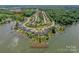 Stunning aerial view of the community with lake access and a community pool at 135 Canoe Pole Ln, Mooresville, NC 28117