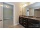 The bathroom features a double vanity with dark cabinets at 135 Canoe Pole Ln, Mooresville, NC 28117