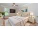 This cozy bedroom is staged with a plush bed, stylish decor, and ample natural light at 135 Canoe Pole Ln, Mooresville, NC 28117