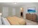Bedroom featuring simple decor with a large dresser and doorway to an ensuite at 135 Canoe Pole Ln, Mooresville, NC 28117