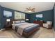 This bedroom features a comfortable bed, neutral tones, and a window with natural light at 135 Canoe Pole Ln, Mooresville, NC 28117