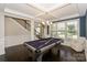 Game room featuring a pool table, dark wood floors, and coffered ceiling at 135 Canoe Pole Ln, Mooresville, NC 28117