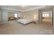 Spacious main bedroom features a seating area and ensuite bath at 135 Canoe Pole Ln, Mooresville, NC 28117