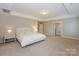 Spacious main bedroom with carpet flooring and a neutral paint palette at 135 Canoe Pole Ln, Mooresville, NC 28117