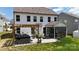 Exterior shot showcasing backyard with a hot tub, patio furniture, and covered porch at 154 Cotton Field Dr, Statesville, NC 28677
