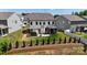 Exterior shot showcasing backyard with a hot tub, patio furniture, covered porch, landscaping, and wooden retaining wall at 154 Cotton Field Dr, Statesville, NC 28677