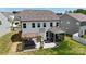 Exterior shot showcasing backyard with a hot tub, patio furniture, covered porch, and landscaping at 154 Cotton Field Dr, Statesville, NC 28677