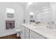 Well-lit bathroom featuring a double vanity, wood-look flooring, and neutral paint at 154 Cotton Field Dr, Statesville, NC 28677