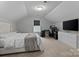 Spacious bedroom with a large bed, computer desk and entertainment center at 154 Cotton Field Dr, Statesville, NC 28677