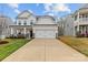 Charming two-story home with a spacious two-car garage and inviting curb appeal with a long driveway at 154 Cotton Field Dr, Statesville, NC 28677