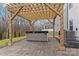 Outdoor hot tub located under a pergola in a fenced backyard at 154 Cotton Field Dr, Statesville, NC 28677