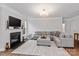 Inviting living room with a fireplace, ample seating, and stylish decor, perfect for entertaining guests at 154 Cotton Field Dr, Statesville, NC 28677