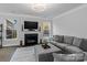 Bright living room with a fireplace, sleek lighting, and comfortable seating, perfect for relaxation at 154 Cotton Field Dr, Statesville, NC 28677