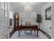 Chic office with an elegant chandelier, complemented by wainscoting and natural light at 154 Cotton Field Dr, Statesville, NC 28677