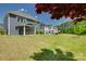 Expansive backyard featuring a screened porch and lush lawn, ideal for outdoor enjoyment at 1540 Striped Bass Ln, Clover, SC 29710