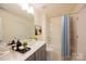Well-lit bathroom with a dual sink vanity and shower/tub combo at 1540 Striped Bass Ln, Clover, SC 29710