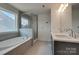 Relaxing primary bathroom features a soaking tub and glass enclosed shower at 1540 Striped Bass Ln, Clover, SC 29710