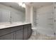 Bright bathroom featuring a double vanity, tiled floor, and a shower and tub combo at 1540 Striped Bass Ln, Clover, SC 29710