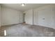 A well lit bedroom with two closet doors and access to another room at 1540 Striped Bass Ln, Clover, SC 29710