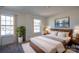 Bright bedroom featuring large windows, a comfortable bed, and modern decor at 1540 Striped Bass Ln, Clover, SC 29710