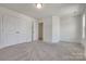 A bright bedroom with large closet and access to other rooms with carpeted flooring at 1540 Striped Bass Ln, Clover, SC 29710