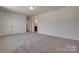 Large bedroom with carpeted flooring, spacious closet and access to a bathroom at 1540 Striped Bass Ln, Clover, SC 29710