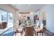 Bright dining room with a glass table, stylish chairs, and access to the backyard at 1540 Striped Bass Ln, Clover, SC 29710
