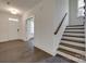 Bright foyer with hardwood flooring, staircase, and doorway with glass French doors at 1540 Striped Bass Ln, Clover, SC 29710