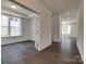 Open-concept layout featuring an office with glass French doors, a staircase and hardwood flooring at 1540 Striped Bass Ln, Clover, SC 29710