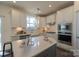 Modern kitchen featuring stainless steel appliances, an island, and ample counter space at 1540 Striped Bass Ln, Clover, SC 29710