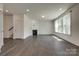 Bright and spacious living room featuring hardwood flooring, fireplace, and large windows at 1540 Striped Bass Ln, Clover, SC 29710