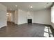 Open-concept living room featuring hardwood flooring, recessed lighting, and a cozy fireplace at 1540 Striped Bass Ln, Clover, SC 29710