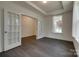 Home office featuring hardwood floors, glass French doors, a tray ceiling and natural light at 1540 Striped Bass Ln, Clover, SC 29710