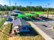 Community playground with green shade canopies and picnic shelter near baseball field at 1540 Striped Bass Ln, Clover, SC 29710
