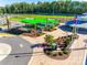 Aerial view of community playground with modern equipment and lush landscaping at 1540 Striped Bass Ln, Clover, SC 29710