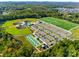 Wide aerial shot showcases baseball fields, soccer fields, tennis courts, and ample parking at recreation area at 1540 Striped Bass Ln, Clover, SC 29710
