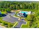 Aerial view of community pool and clubhouse with ample parking and green space at 1540 Striped Bass Ln, Clover, SC 29710