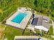 Aerial shot of the community pool, surrounded by lush landscaping and a clubhouse at 1540 Striped Bass Ln, Clover, SC 29710
