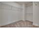Bright walk-in closet featuring wire shelving and neutral carpeting, ready for personalized organization at 1540 Striped Bass Ln, Clover, SC 29710