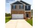 Charming two-story home with a two-car garage and manicured lawn at 156 Parker Claire Ln, Kings Mountain, NC 28086