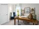 Charming office space with a wooden desk, accent chair, and decorative shelving at 156 Parker Claire Ln, Kings Mountain, NC 28086