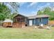 Relaxing backyard with a fire pit and wooden deck, perfect for entertaining at 1724 Virginia St, Monroe, NC 28110