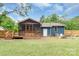 A home's backyard features a screened-in porch, fire pit, and lawn at 1724 Virginia St, Monroe, NC 28110