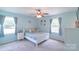 Airy bedroom with abundant natural light, soft carpet, and neutral decor at 1724 Virginia St, Monroe, NC 28110