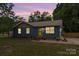Charming single-story home with a well-manicured lawn and inviting yellow door at 1724 Virginia St, Monroe, NC 28110