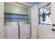 Convenient laundry room with a washer, dryer, shelving, and easy access to the outdoors at 1724 Virginia St, Monroe, NC 28110