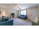 Bright living room with plush sofas, a ceiling fan, and a large window at 1724 Virginia St, Monroe, NC 28110